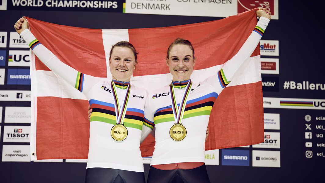 Amalie Dideriksen and Julie Leth celebrate their gold medal victory in the Madison at the UCI Track World Championships