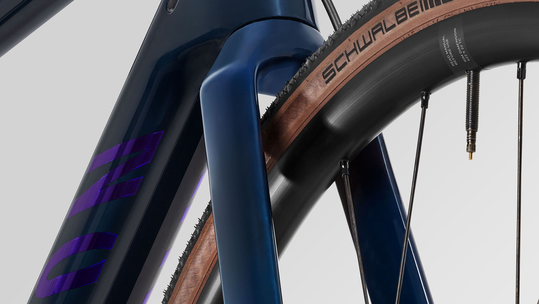 Close-up of Canyon all-road bike fork and tire showing high-performance carbon and aluminium frame materials